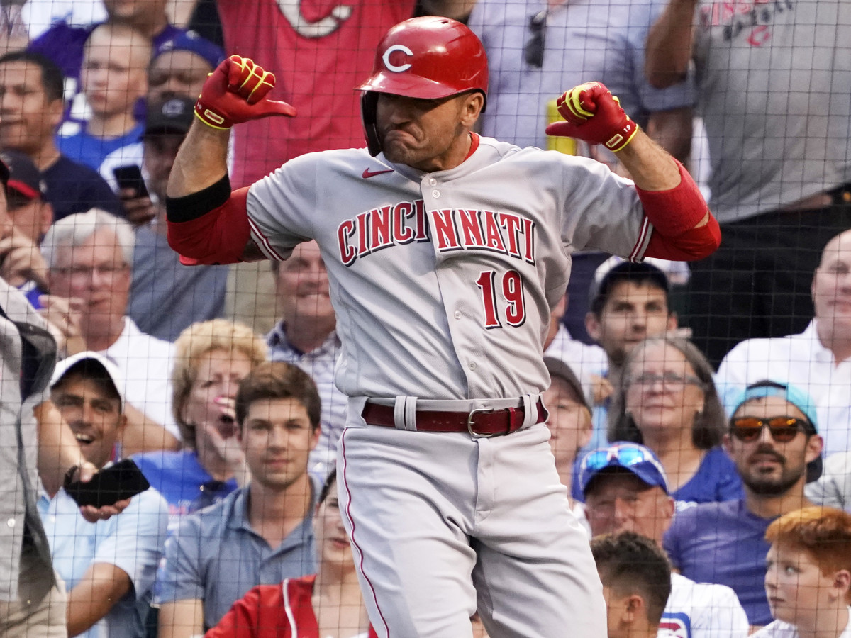 Jul 28, 2021; Chicago, Illinois, USA; Cincinnati Reds first baseman Joey Votto (19) gestures as he crosses home plate after hitting a home run against the Chicago Cubs during the second inning at Wrigley Field.